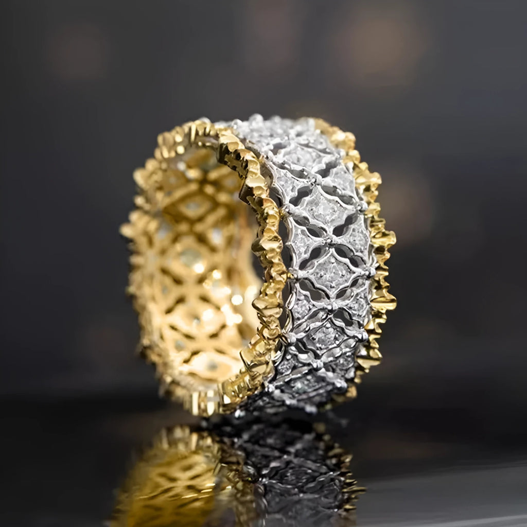 Geometric copper zircon ring with two-tone gold electroplating showing round centre stone