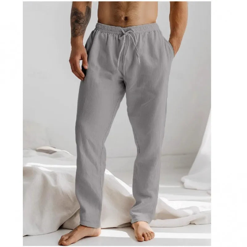 Men's light grey loose-fit summer trousers with elastic waistband and straight leg opening