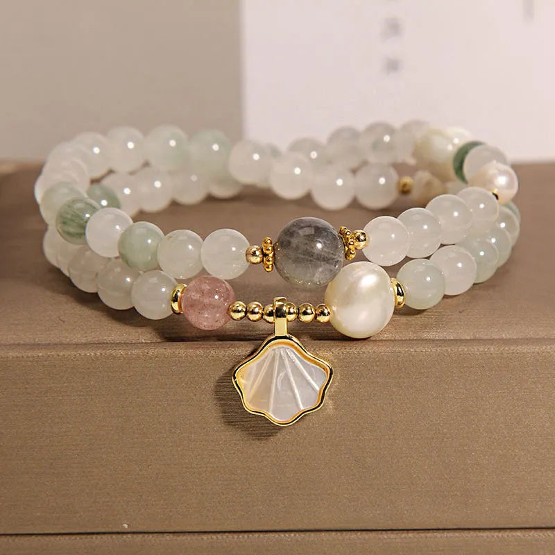 Tianshan emerald green crystal bracelet with gold-plated apricot leaf pendant and rhinestone details