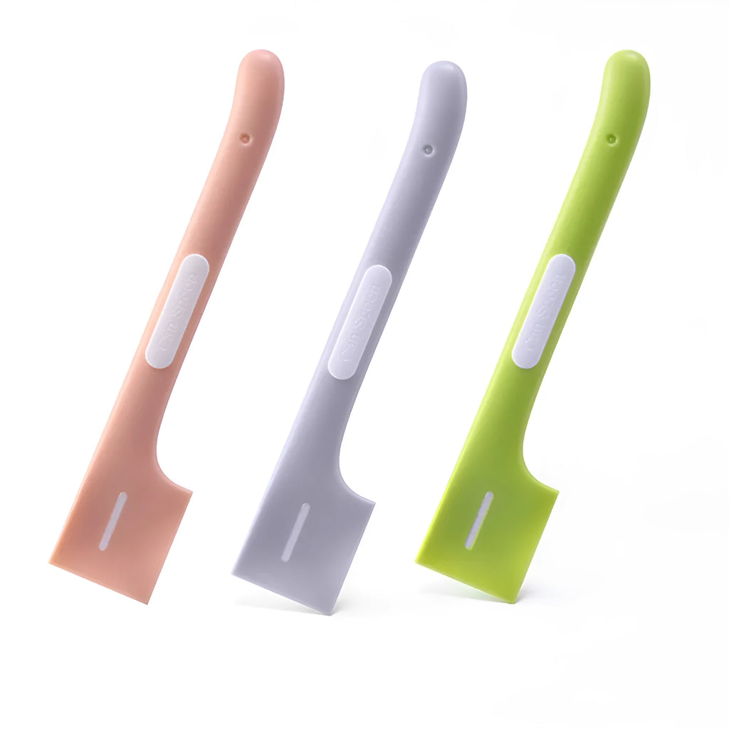 Long green TPR pet food spoon with right-angle head for feeding from tins