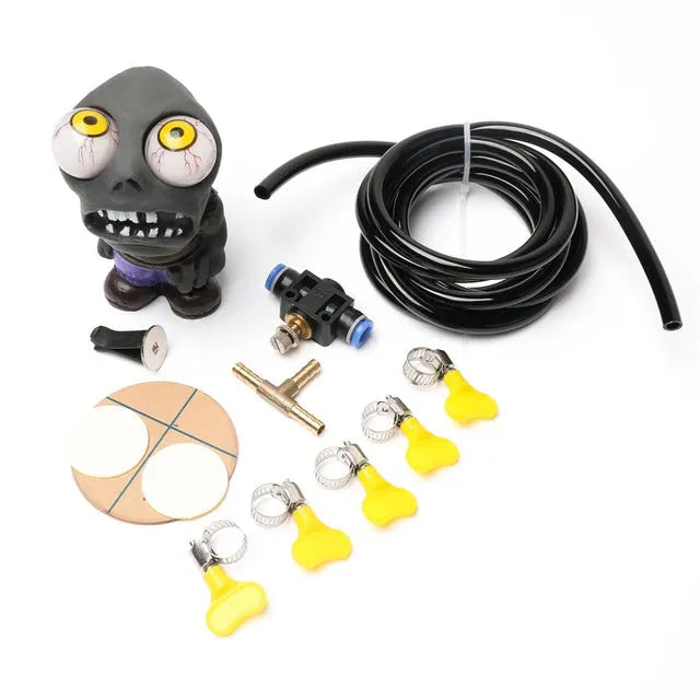 Turbo car decompress ornament kit showing rubber doll, copper three-way tube, pressure valve, and PU tubing on a white background.