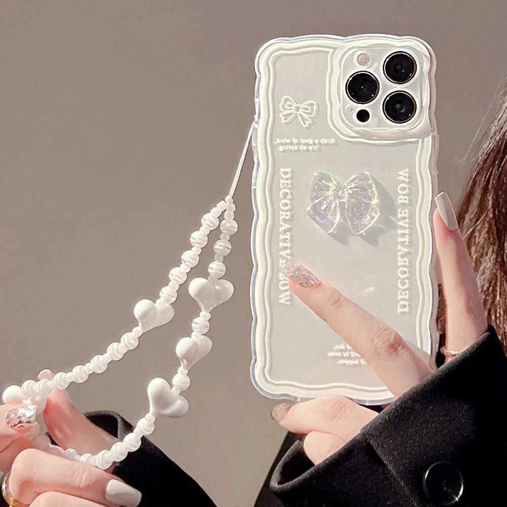 Clear transparent iPhone case with a raised 3D ice-effect bow design on the back.
