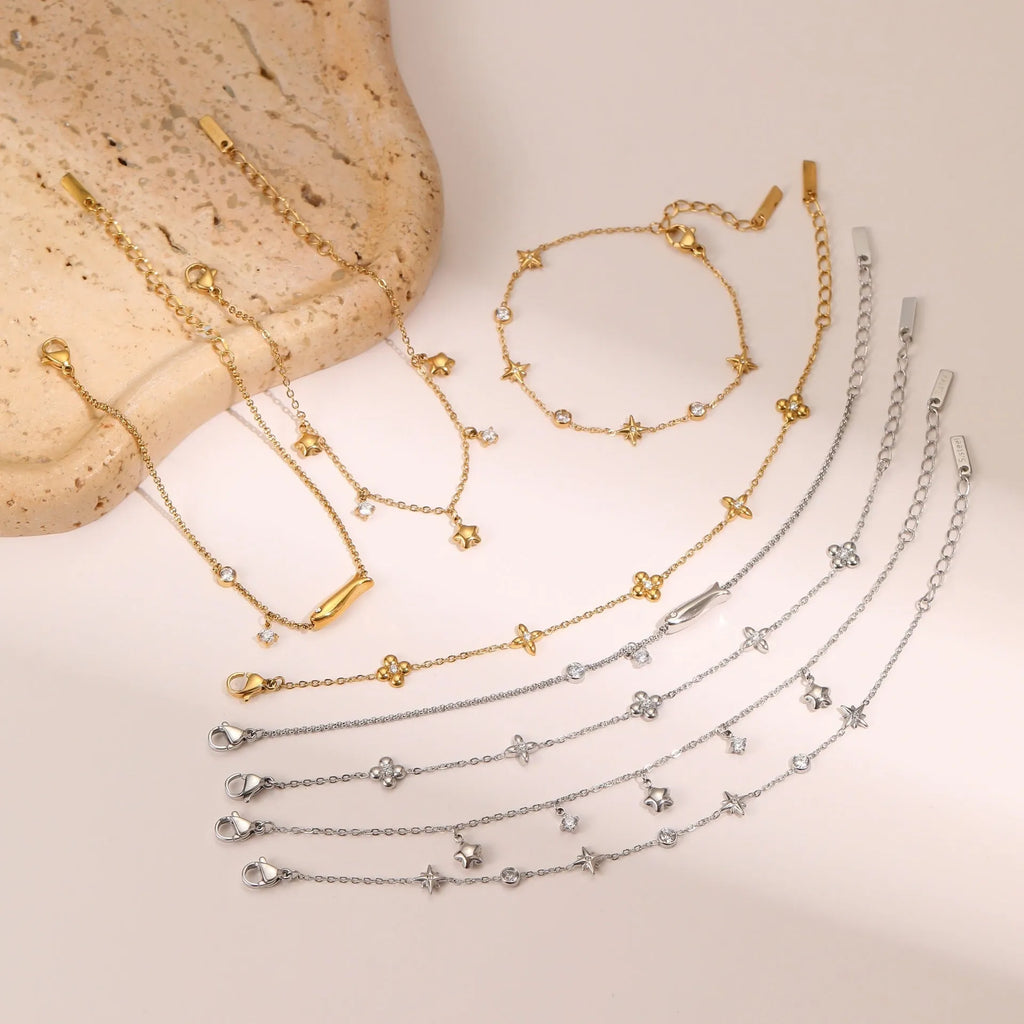 Women's gold-plated bracelet with a geometric zircon star pendant on a stainless steel chain.