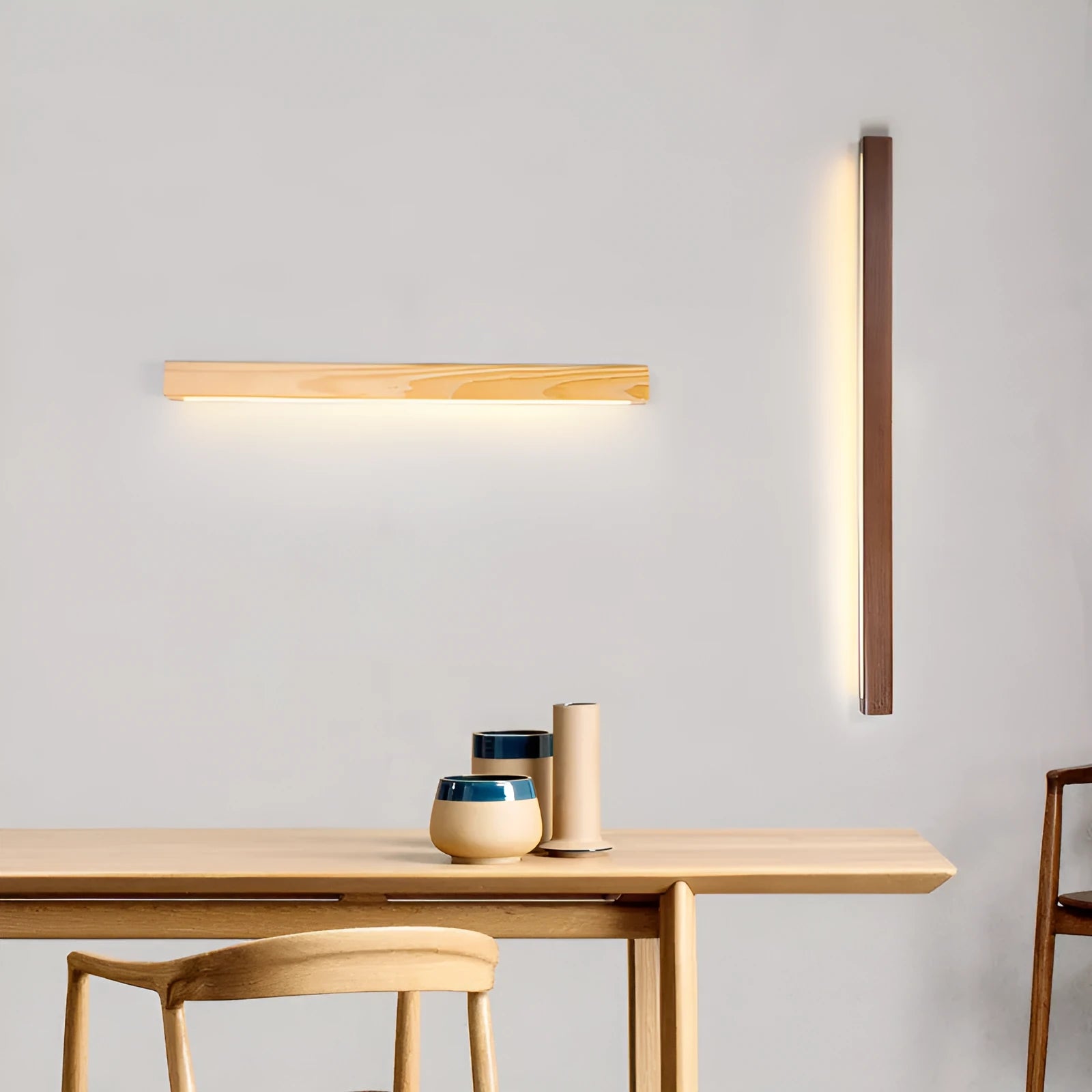 Walnut colour wood and acrylic wall lamp strip with LED lighting in a minimalist design on a wall.