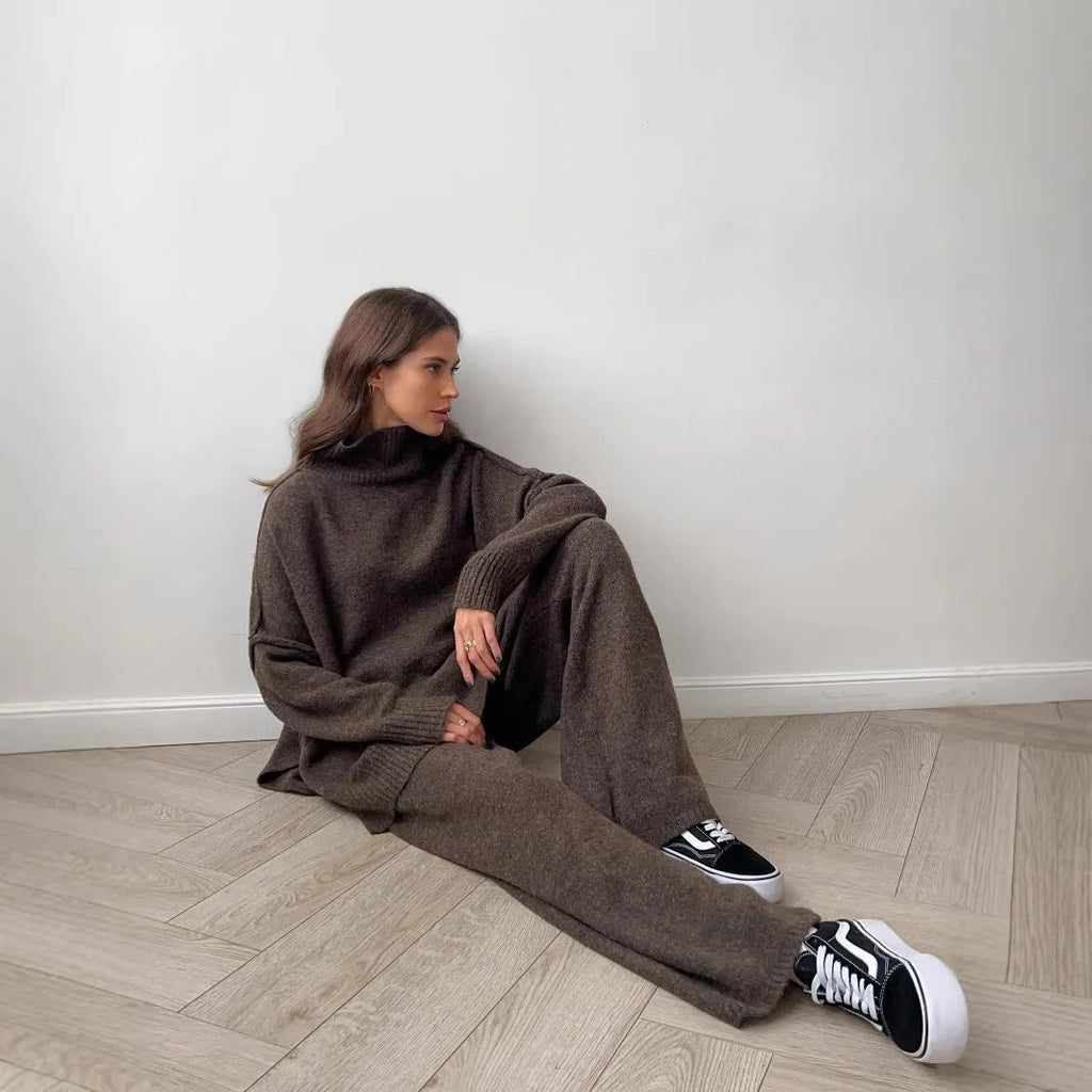 Women's dark grey acrylic sweater with side slits paired with matching trousers