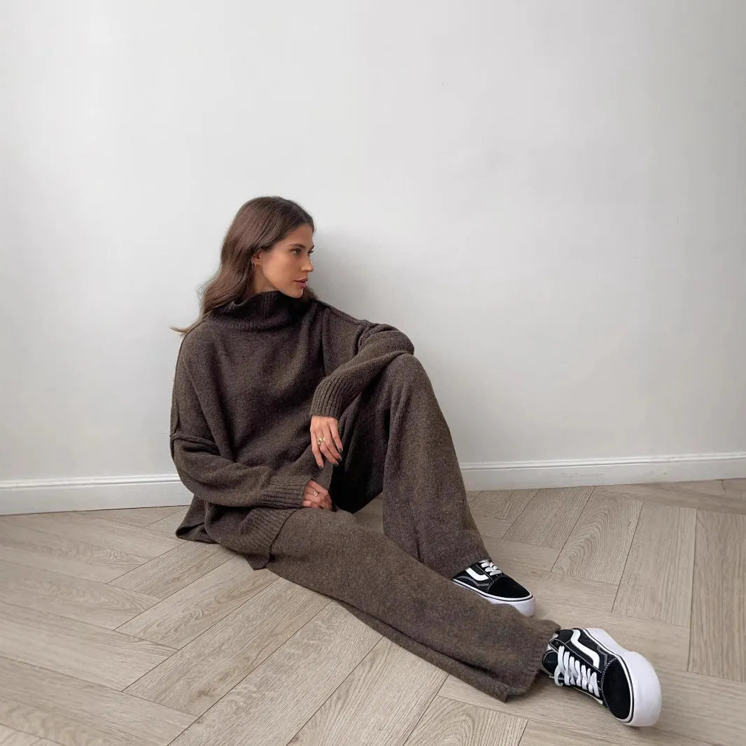 Women's dark grey acrylic sweater with side slits paired with matching trousers