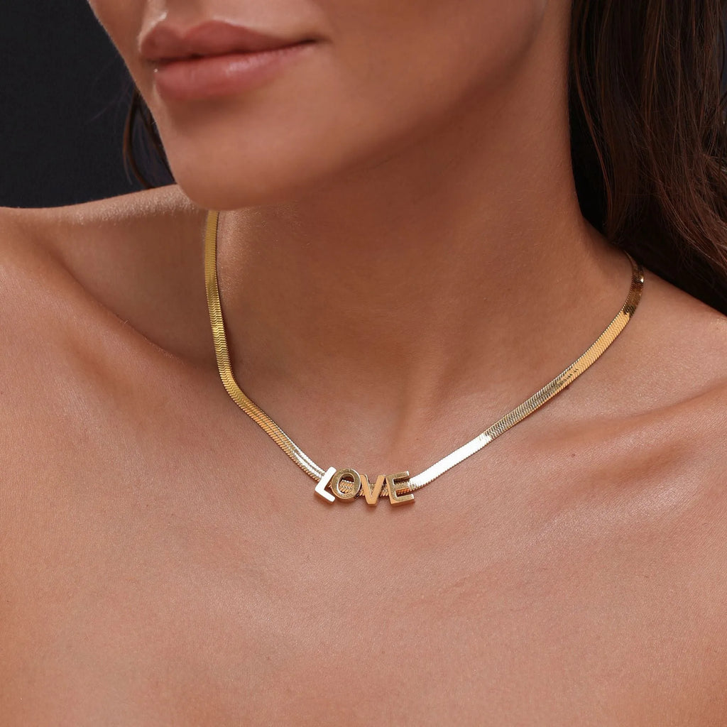 Titanium steel personalised necklace showing letter pendant on 40.5cm chain with electroplated gold finish