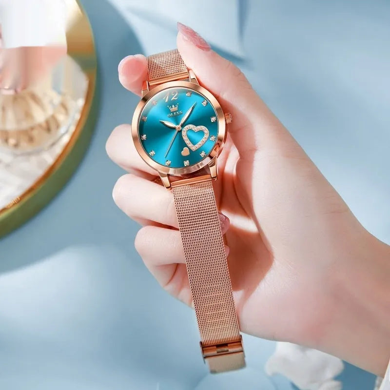 Women's rose gold fashion watch with mesh strap showing six dial colour options