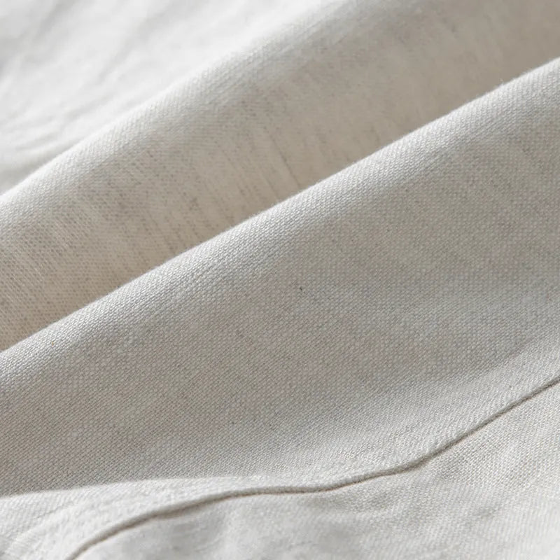 Men's loose fit linen casual blazer jacket on a hanger, shown in a solid colour.