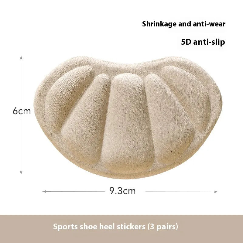 Camel-coloured anti-blister heel cushion pads with suede surface measuring 9.3x6 cm