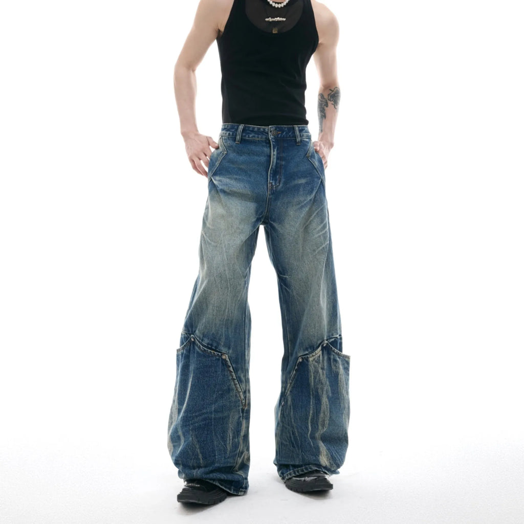 Men's verdant blue retro jeans with a curved knife cut and washed burst pattern