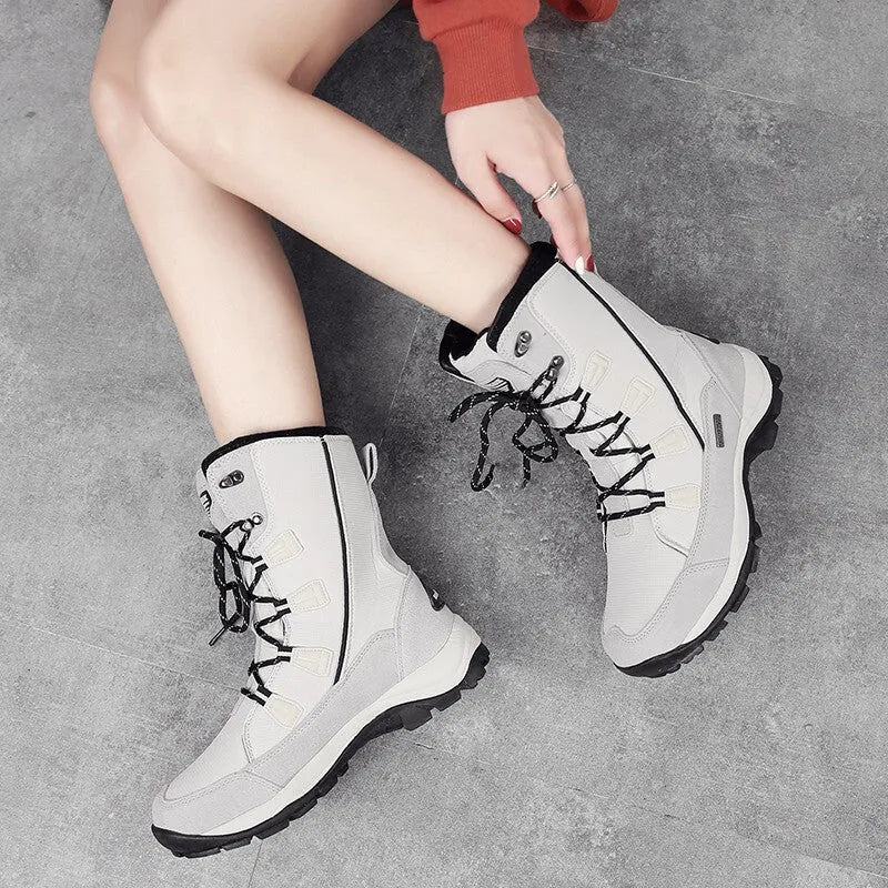 Women's genuine leather mid-calf thermal snow boots in black colour with round toe and rubber sole