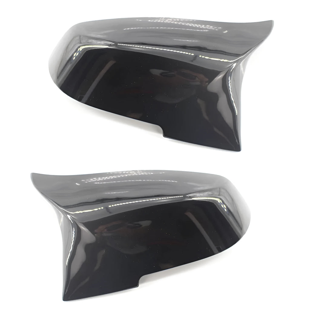Pair of paint bright black BMW rear-view mirror replacement shells for 3 Series and 4 Series models.