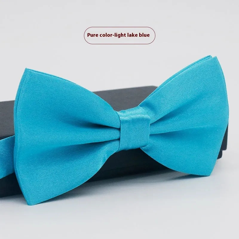 Men's flat head style polyester bow tie in a solid colour, shown with adjustable neck strap.