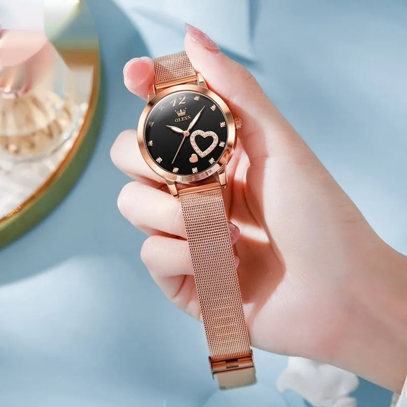 Women's rose gold fashion watch with mesh strap showing six dial colour options