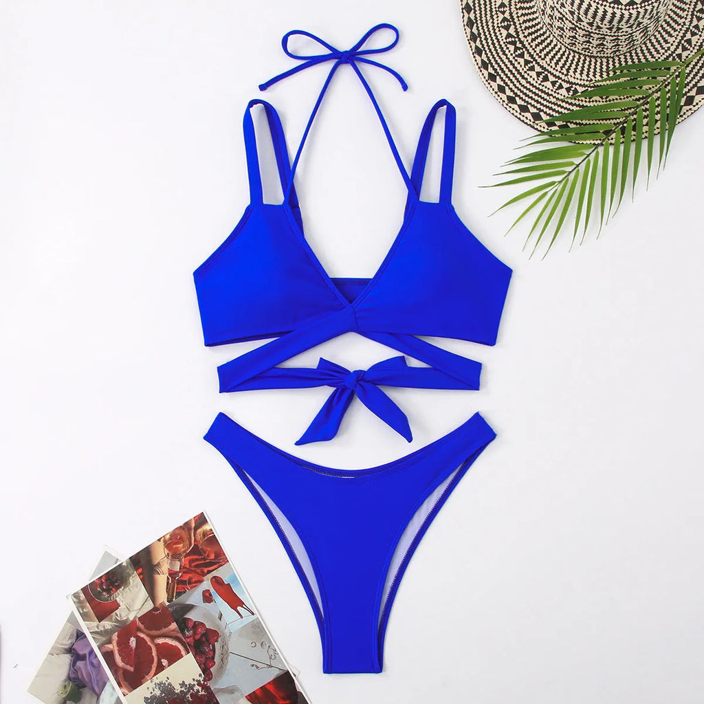 Women's solid colour bikini swimsuit with adjustable straps on triangle top in black, blue, red, rose red, or white