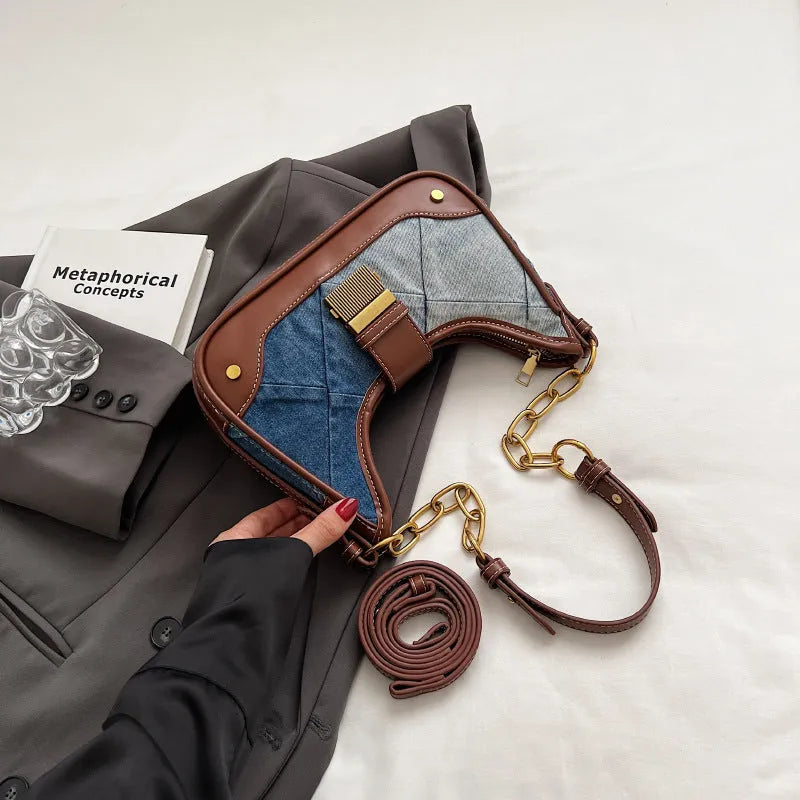 Brown denim bucket shoulder bag with diamond mesh pattern and chain decorative elements