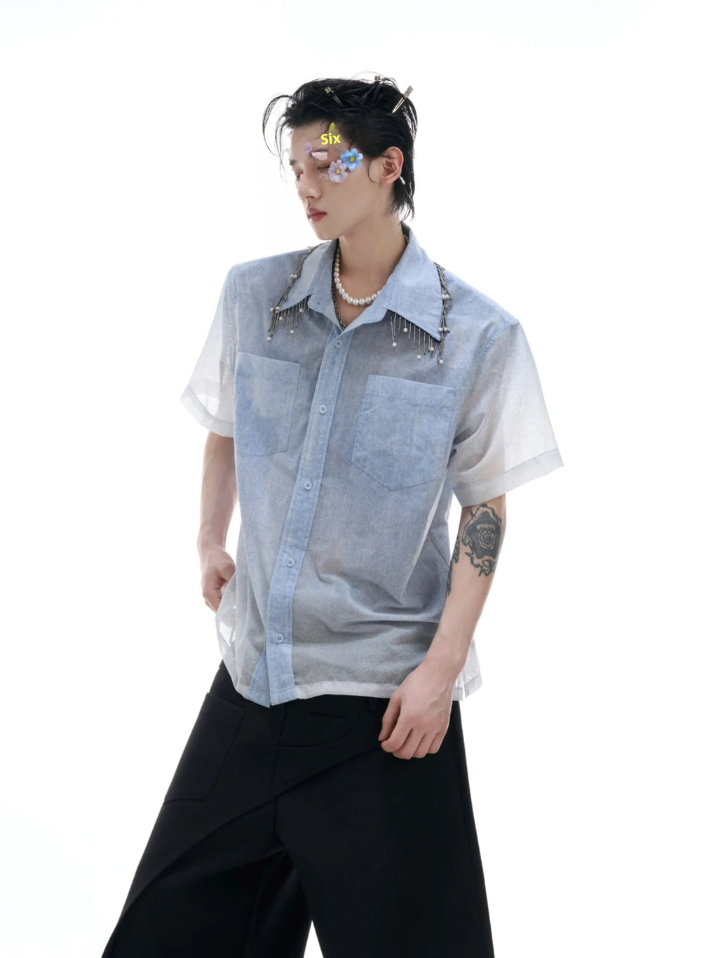 Man wearing a blue and white gradient loose fit short sleeve polyester summer shirt