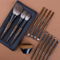 12-piece makeup brush set with wooden handles in grey PU storage case
