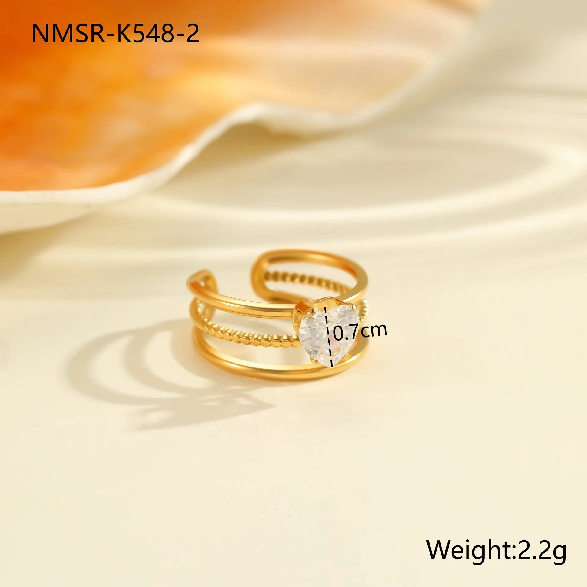 Stainless steel women's ring with gold electroplating and zircon details in geometry design