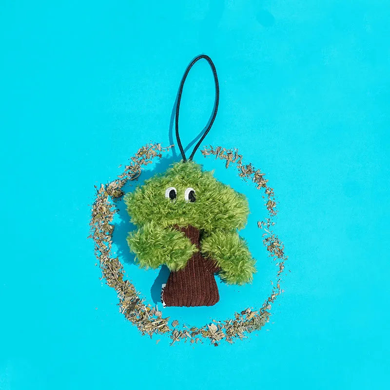 Pine tree shaped cat toy with bag pendant, showing small, medium, and large size options