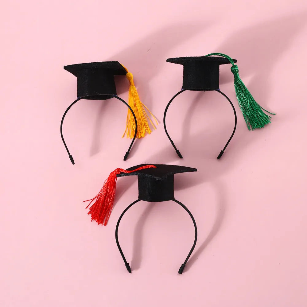 British-style Doctor's Degree elastic hair band and woolen felt bow tie set for a cat or dog, shown in yellow cap colour option.