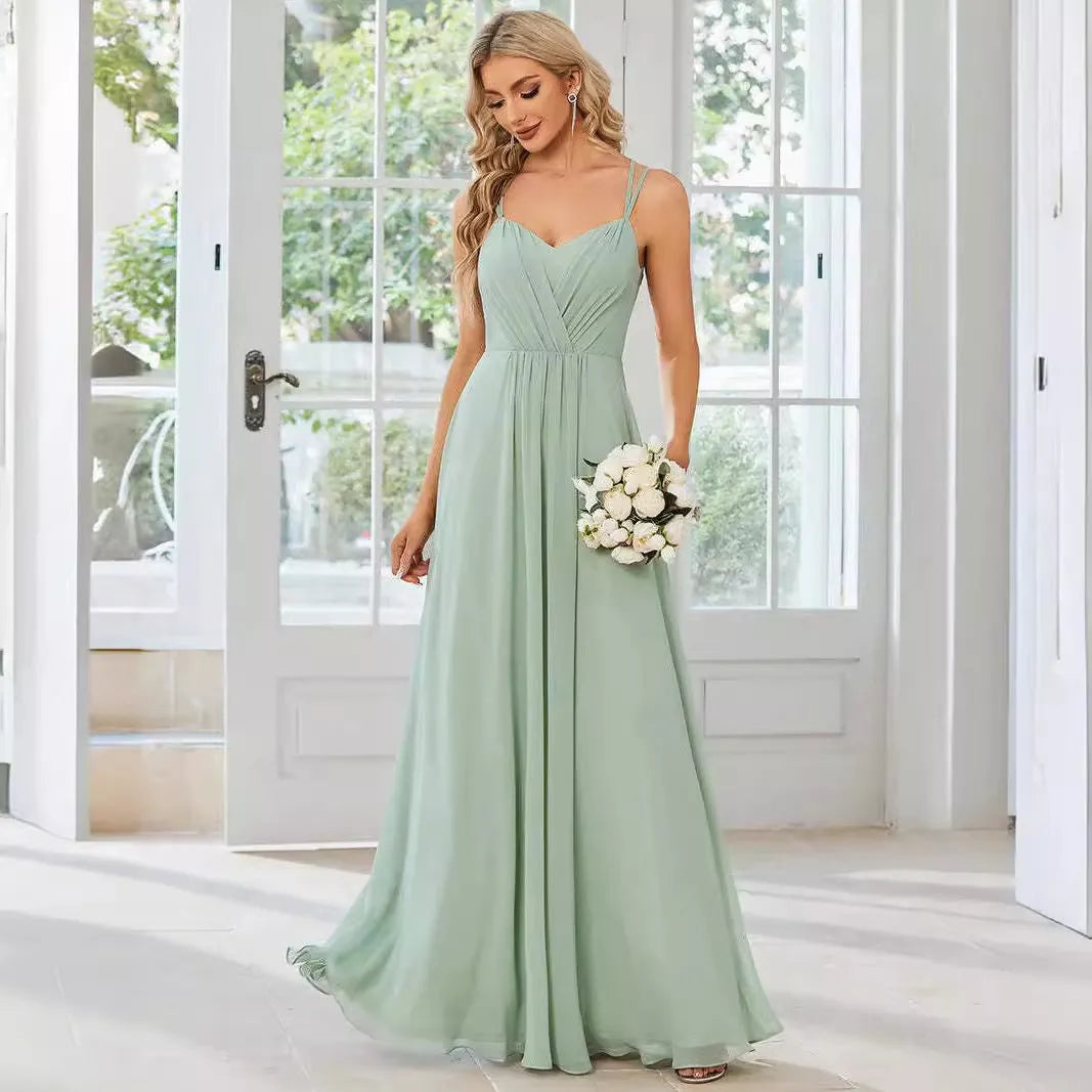 Women's sleeveless pleated A-line dress in light green with sling neckline for banquet occasions