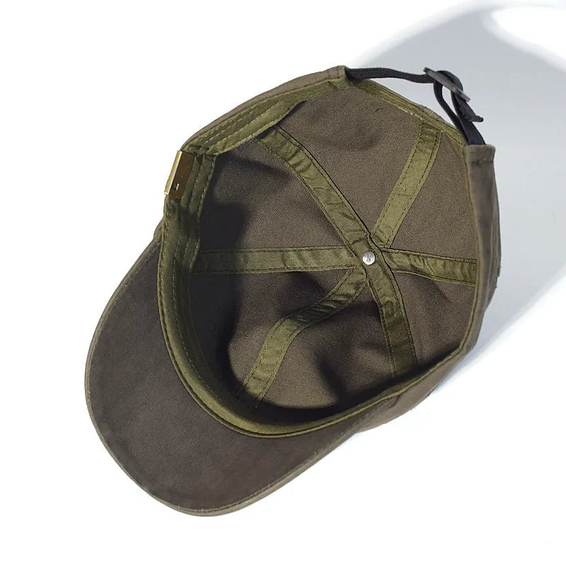 Unstructured cotton dad hat in khaki with short 5.5 cm brim and adjustable strap, front view