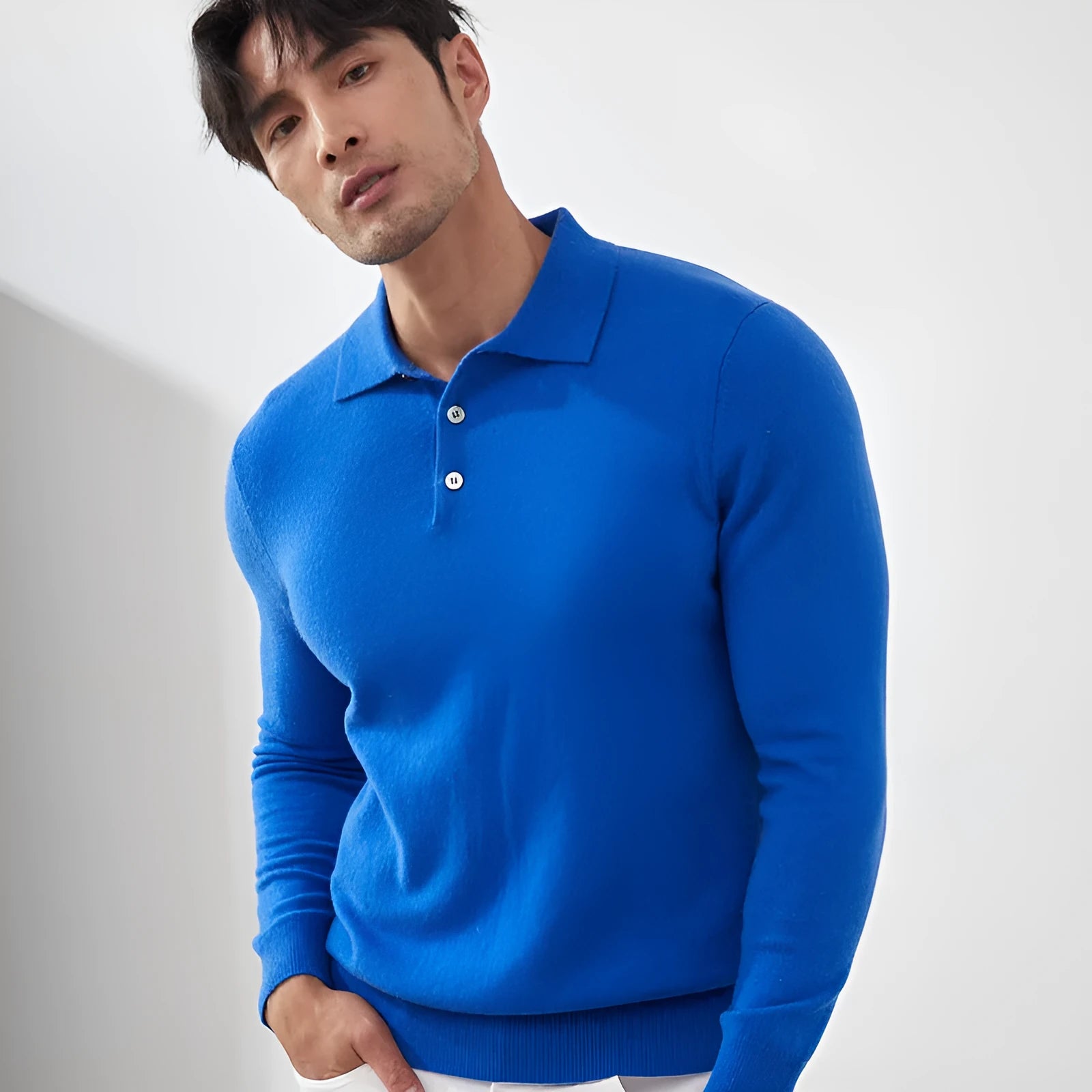 Men's sapphire blue cashmere pullover sweater with a polo collar in a loose fit.