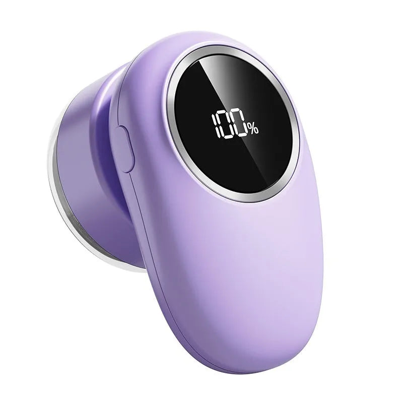 Beige and purple digital fur ball trimmer devices with removable cutter heads on a fabric background