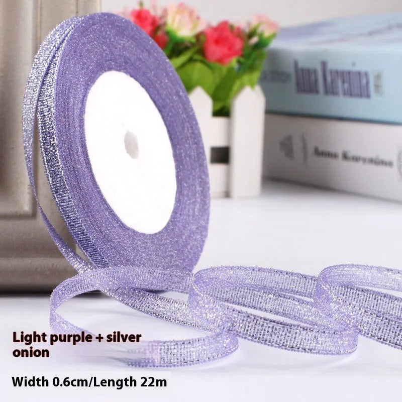 Roll of 0.6cm wide polyester gift ribbon in various colours including gold leaf, coffee and sky blue options