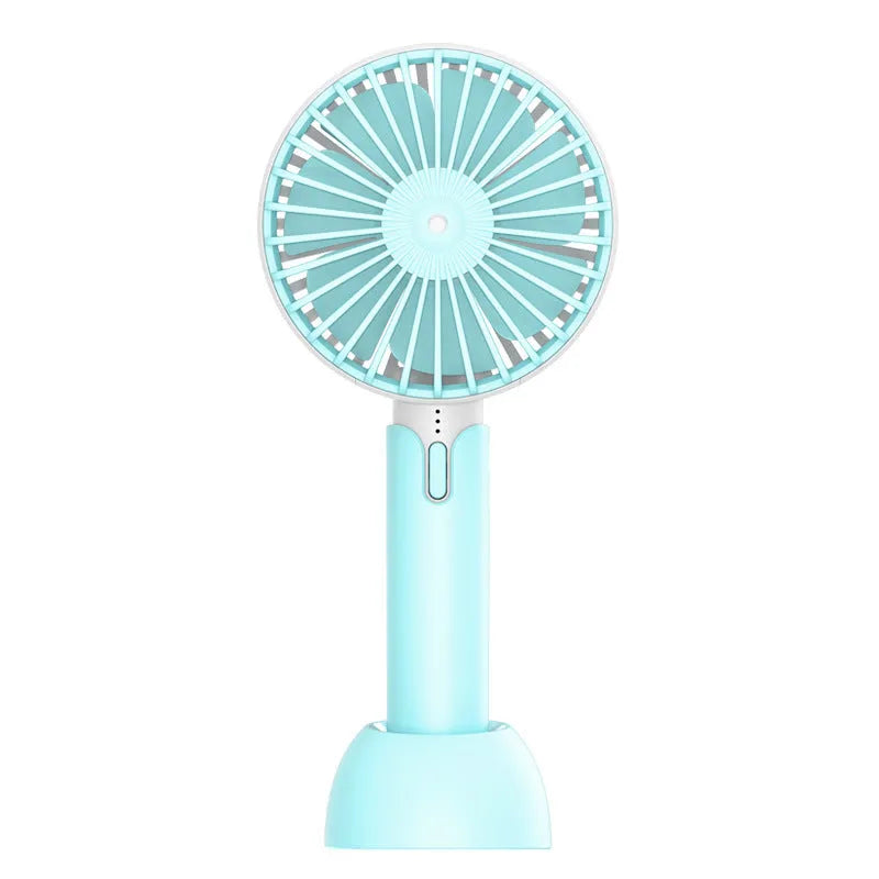Blue mini handheld USB electric fan with three-speed control on a desk.