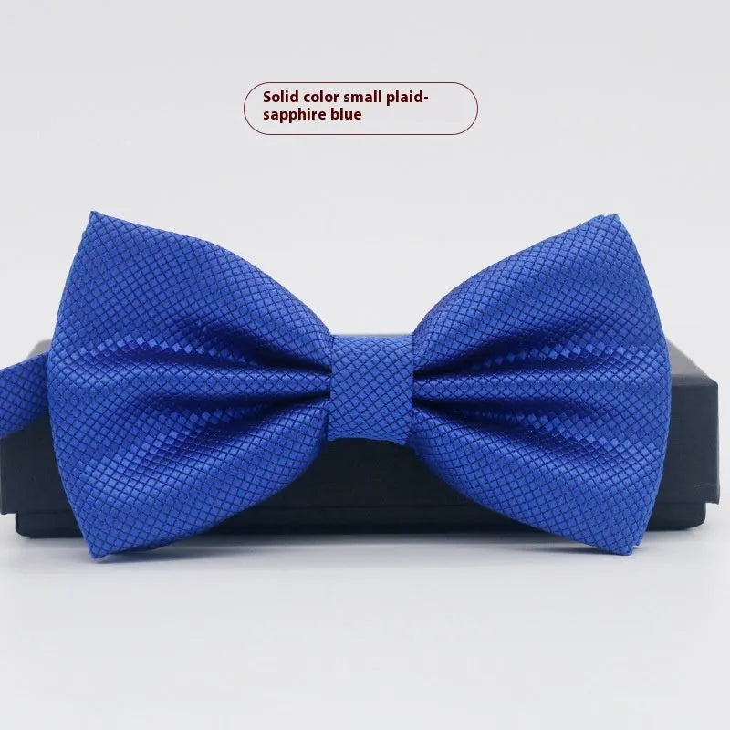 Men's flat head style polyester bow tie in a solid colour, shown with adjustable neck strap.