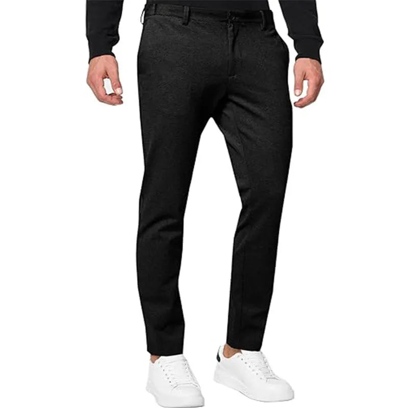Men's slim-fit tapered chino pants in Army Green colour, showing pleated front and zipper fly detail.