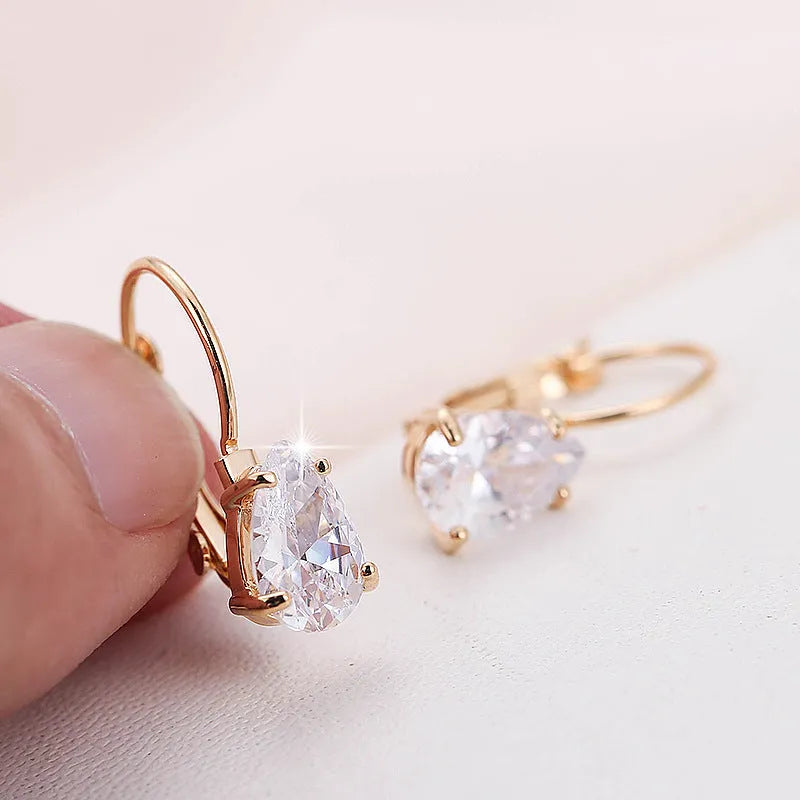 Gold and platinum coloured drop-shaped fashion earrings with metallic finish