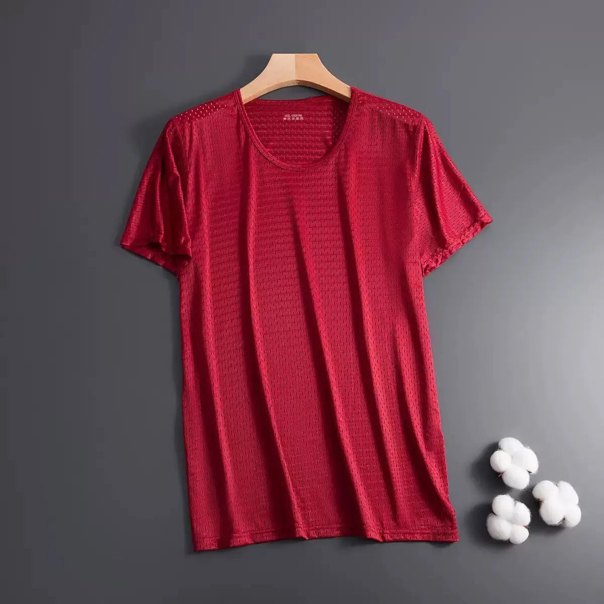 Man wearing a loose-fit grey Ice Silk short sleeve crew neck T-shirt.