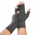 Gray half-finger joint compression gloves showing anti-slip grip details and polyester-spandex fabric texture