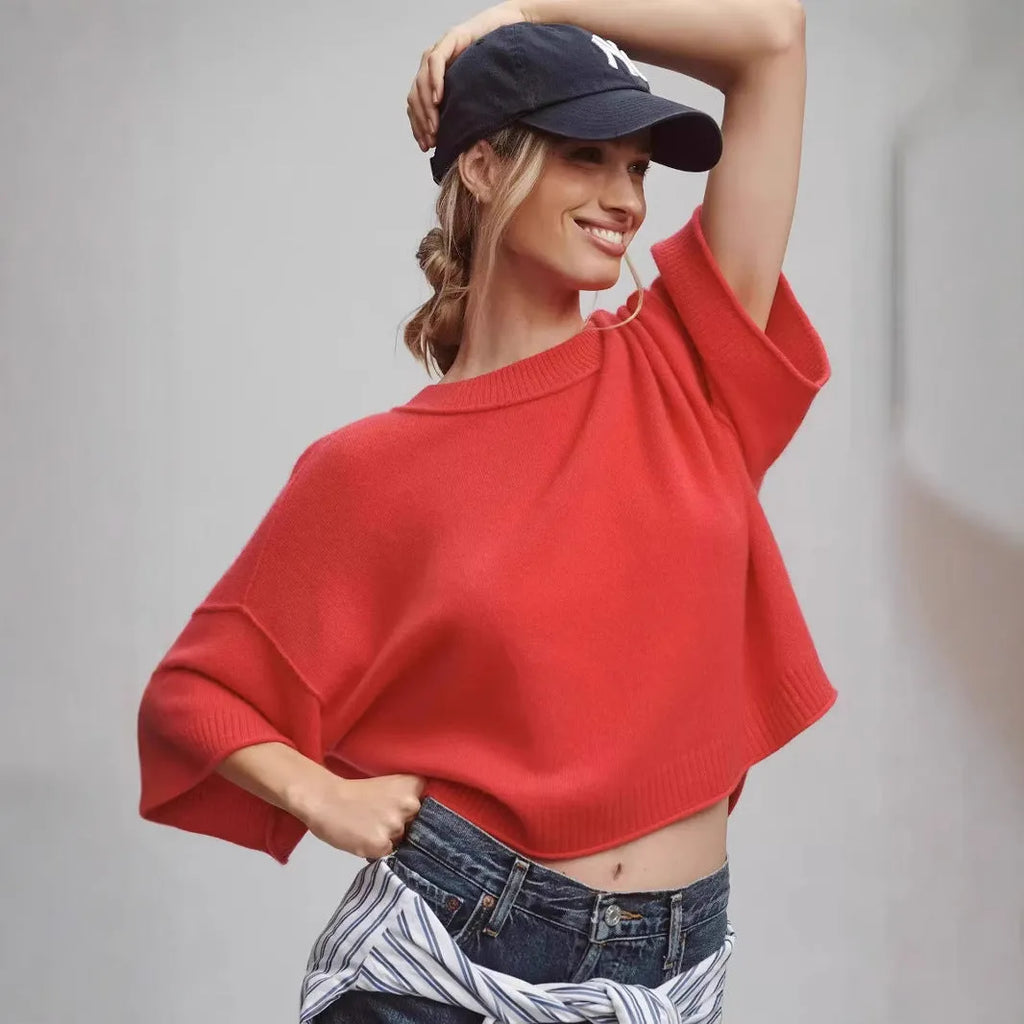 Red hot girl style viscose t-shirt with short sleeves and an exposed navel cut on a mannequin.