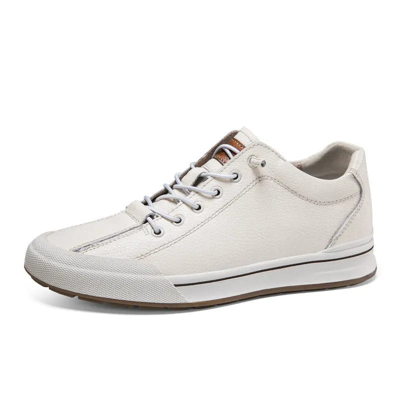 Men's white leather casual shoes with flat heel and round toe on a plain background