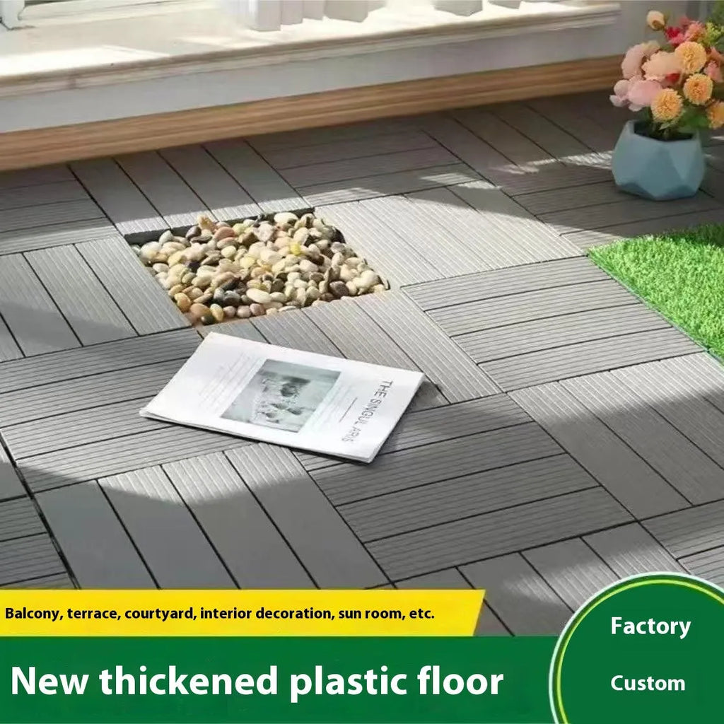 Wood grain plastic interlocking floor tile showing non-slip surface texture