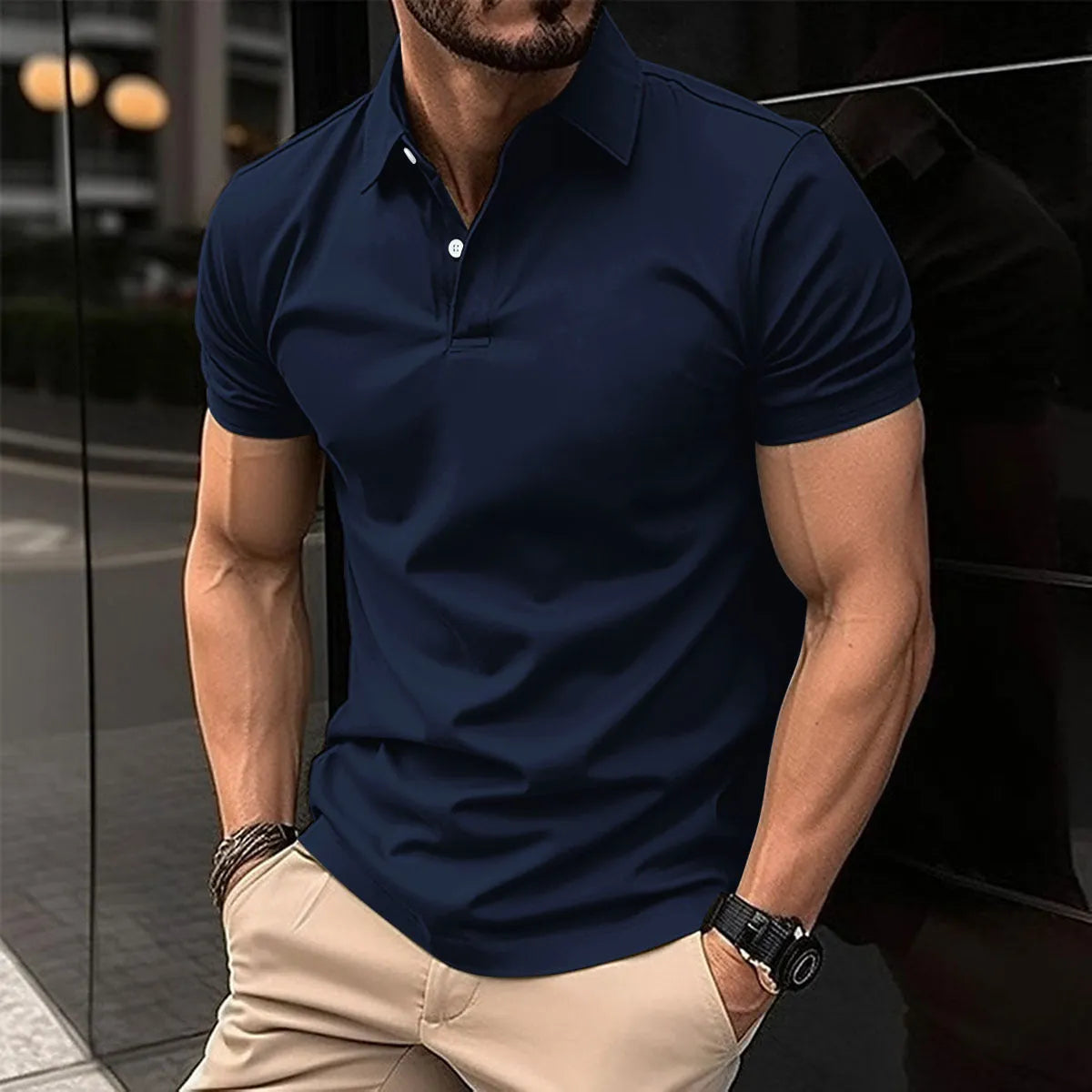 Men's solid colour short sleeve polo shirt with buttoned lapel collar on a hanger.