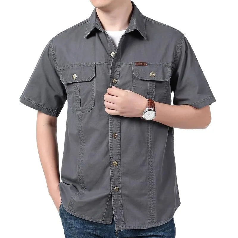 Men's cotton short sleeve loose fit cardigan shirt in dark blue on a model, summer workwear style