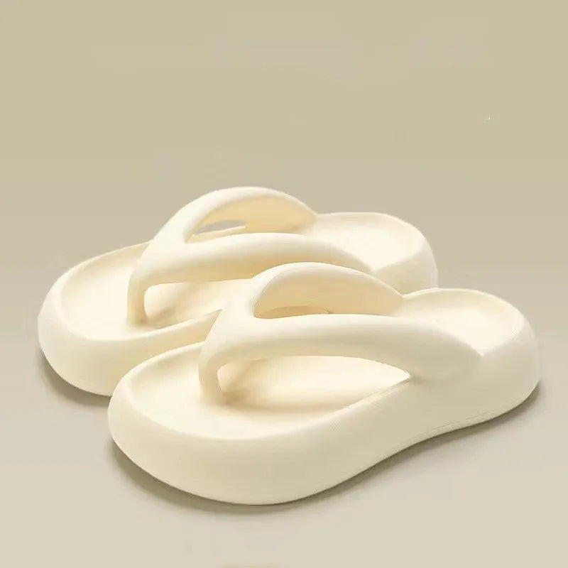 A pair of EVA thick-soled flip-flops with a bow detail on the upper, shown in one of the available colours.