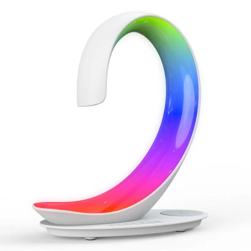 White swan-shaped desk lamp with colourful LED lights, Bluetooth speaker, and wireless charging pad.