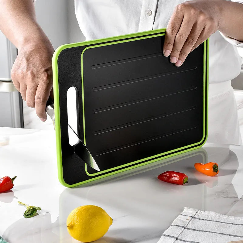 Grey square double-sided aluminium cutting board with hanging loop, defrosting surface, and built-in whetstone