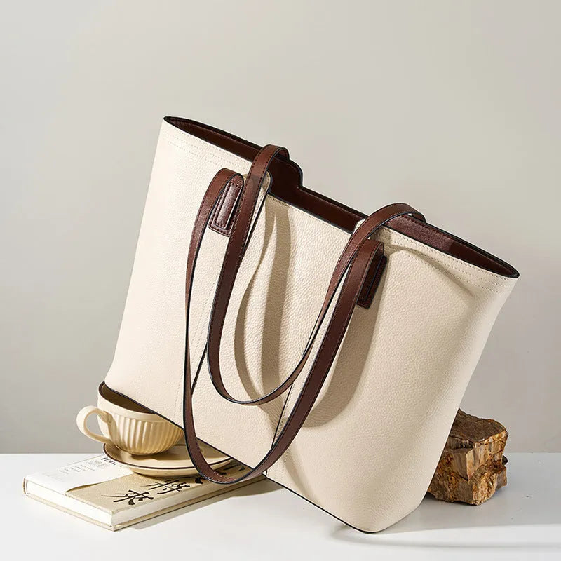 Women's black genuine leather commuter shoulder bag with multiple internal compartments