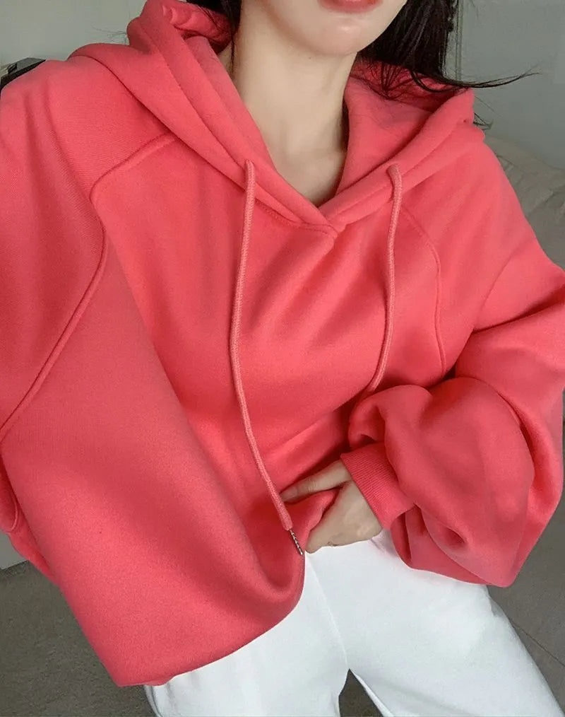 Watermelon red women's loose fit mulberry silk hooded sweater on a hanger.