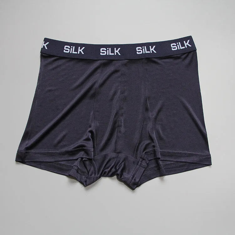 Men's loose fit silk shorts in navy blue, silver grey, and skin colour options