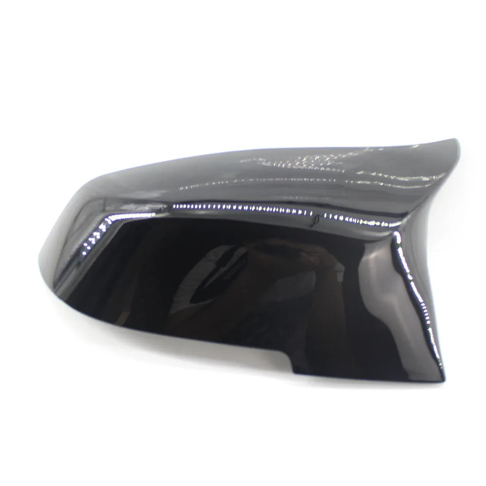 Pair of paint bright black BMW rear-view mirror replacement shells for 3 Series and 4 Series models.