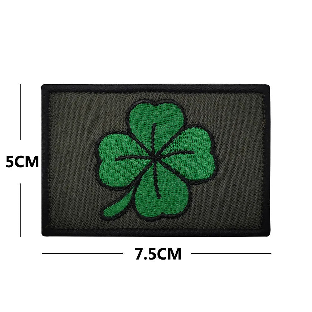 Embroidered fabric badge with hook and loop backing in various colour designs for industrial textile use